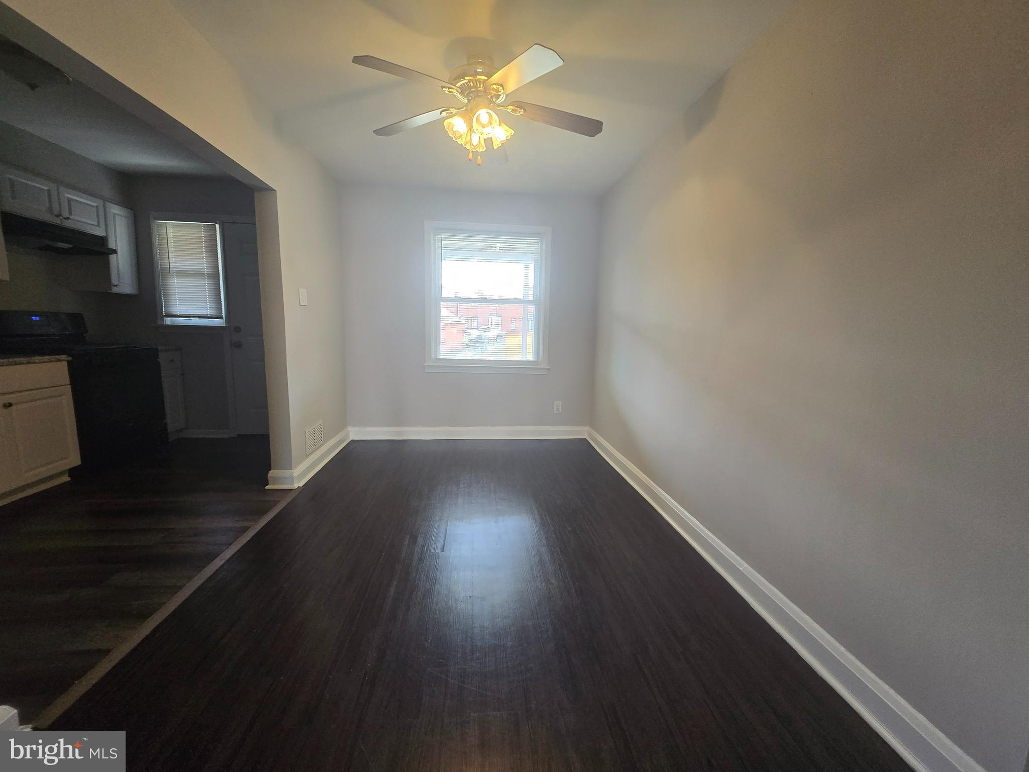 803 North Marlyn Avenue Baltimore, MD 21221 - Photo 4 of 22 a view of empty room with wooden floor and fan