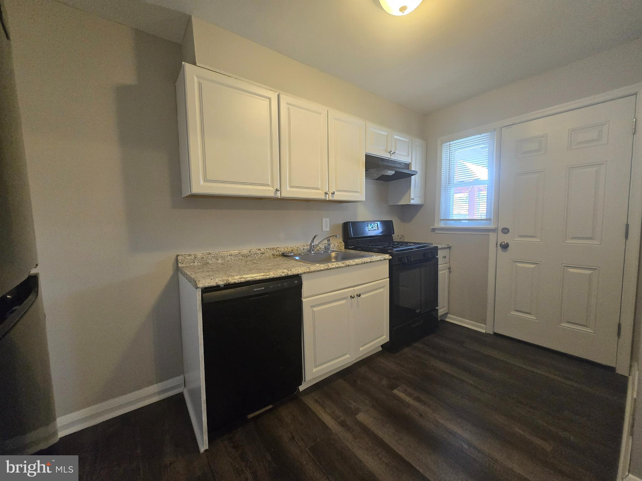 803 North Marlyn Avenue Baltimore, MD 21221 - Photo 5 of 22 a kitchen with sink cabinets and window