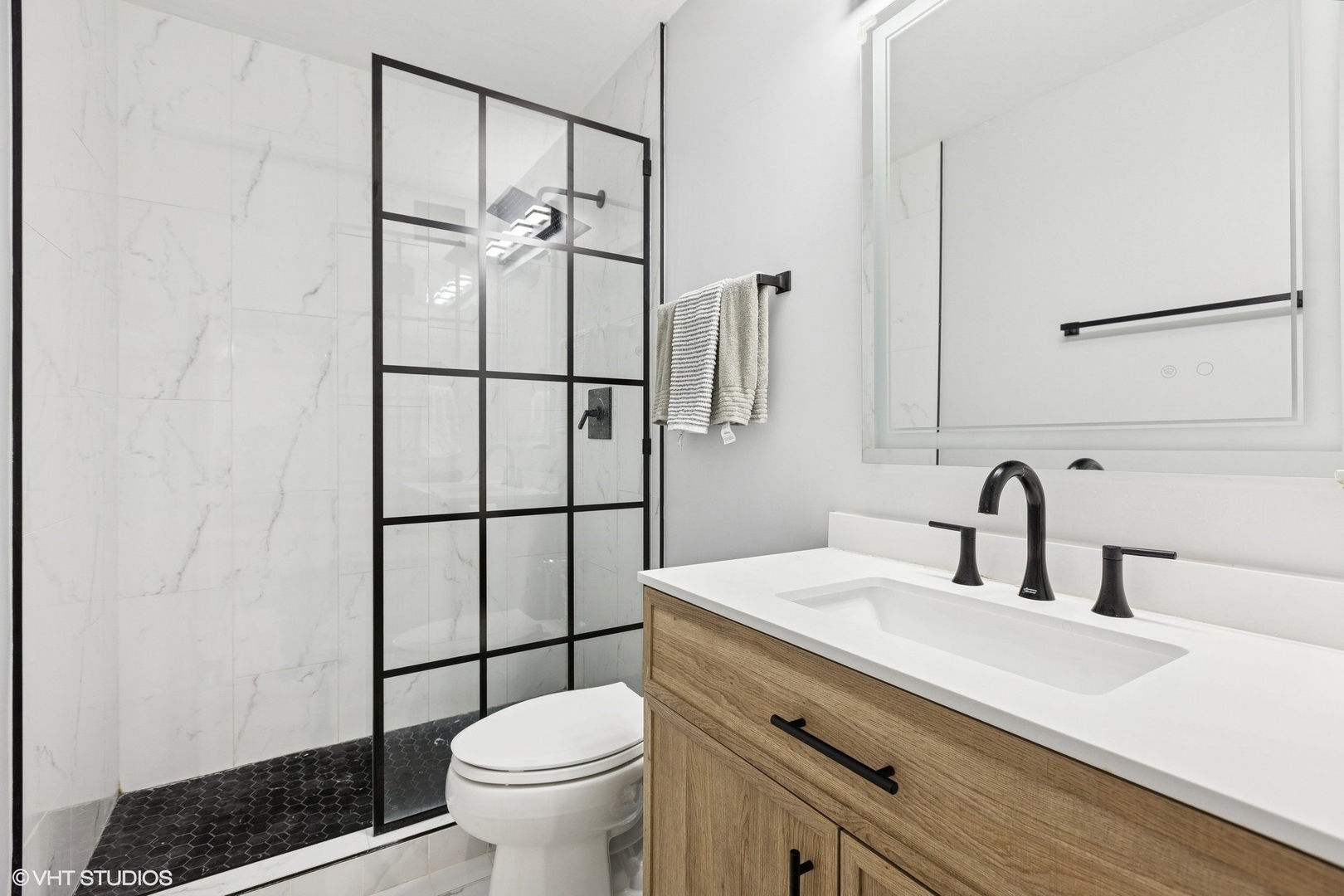 3600 North Lake Shore Drive, Unit 1108 Chicago, IL 60613 - Photo 11 of 12 a bathroom with a sink toilet and shower