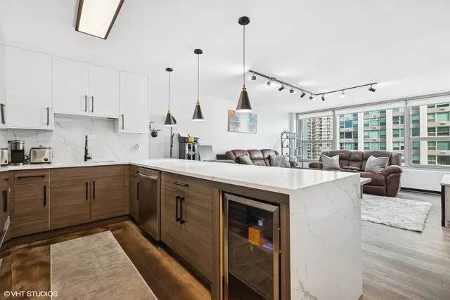 a kitchen with appliances cabinets and a counter top space