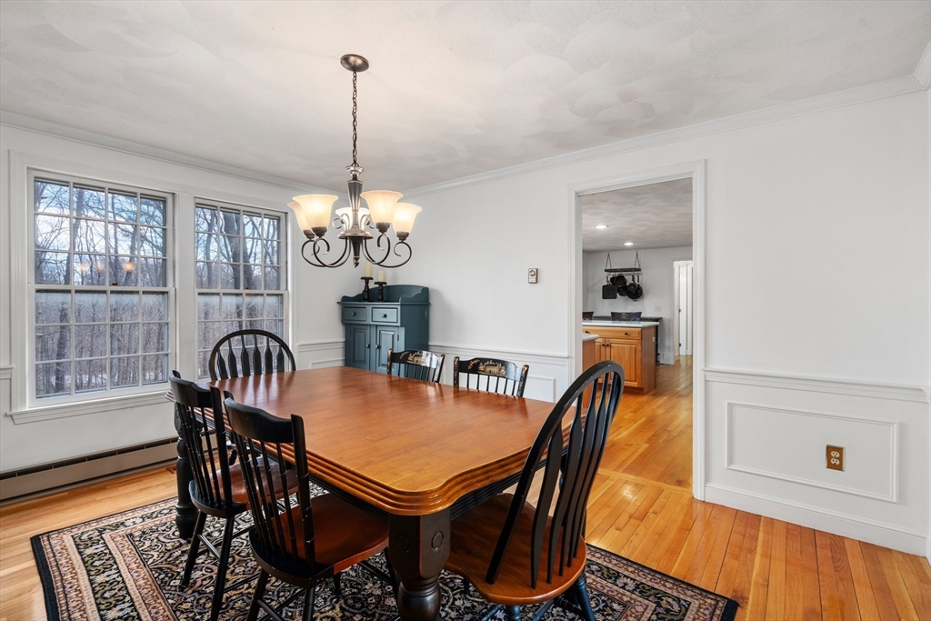 4 Greybirch Road Andover, MA 01810 - Photo 15 of 42 a dining room with furniture a chandelier and wooden floor