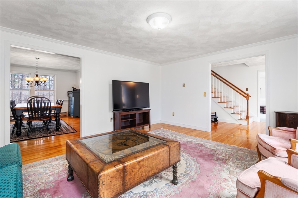 4 Greybirch Road Andover, MA 01810 - Photo 17 of 42 a living room with furniture and a flat screen tv