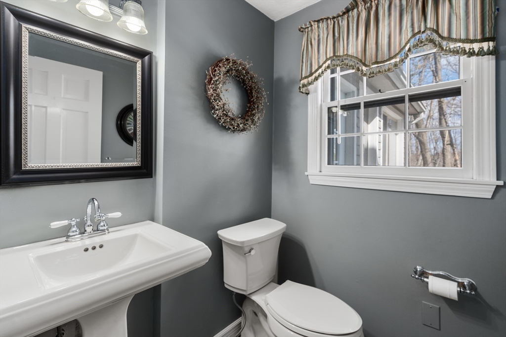 4 Greybirch Road Andover, MA 01810 - Photo 19 of 42 a bathroom with a toilet a sink and mirror