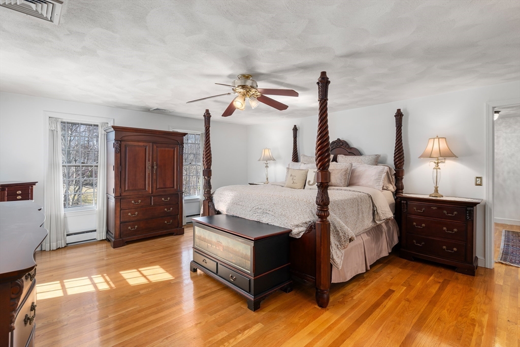 4 Greybirch Road Andover, MA 01810 - Photo 22 of 42 a spacious bedroom with a bed and dresser