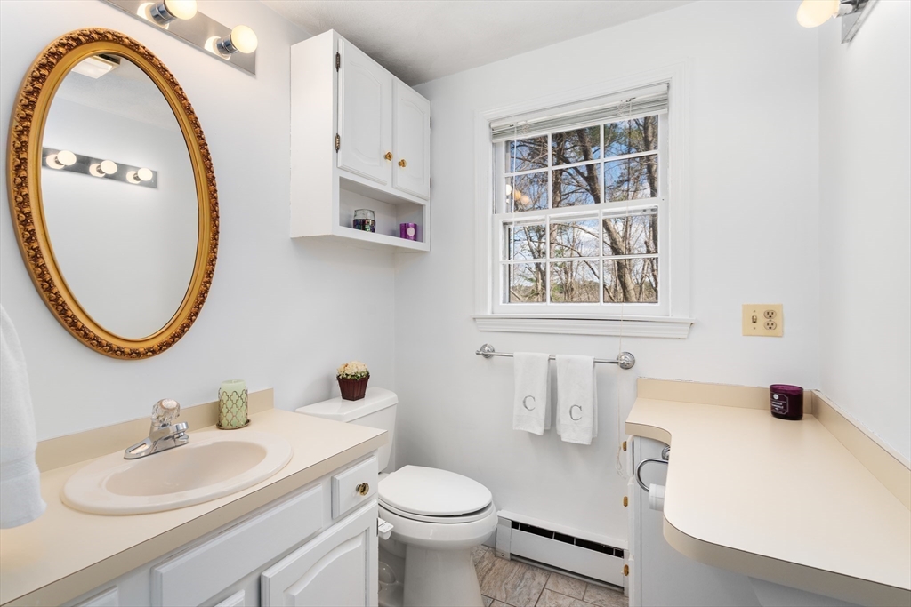 4 Greybirch Road Andover, MA 01810 - Photo 24 of 42 a bathroom with a sink a toilet and a mirror