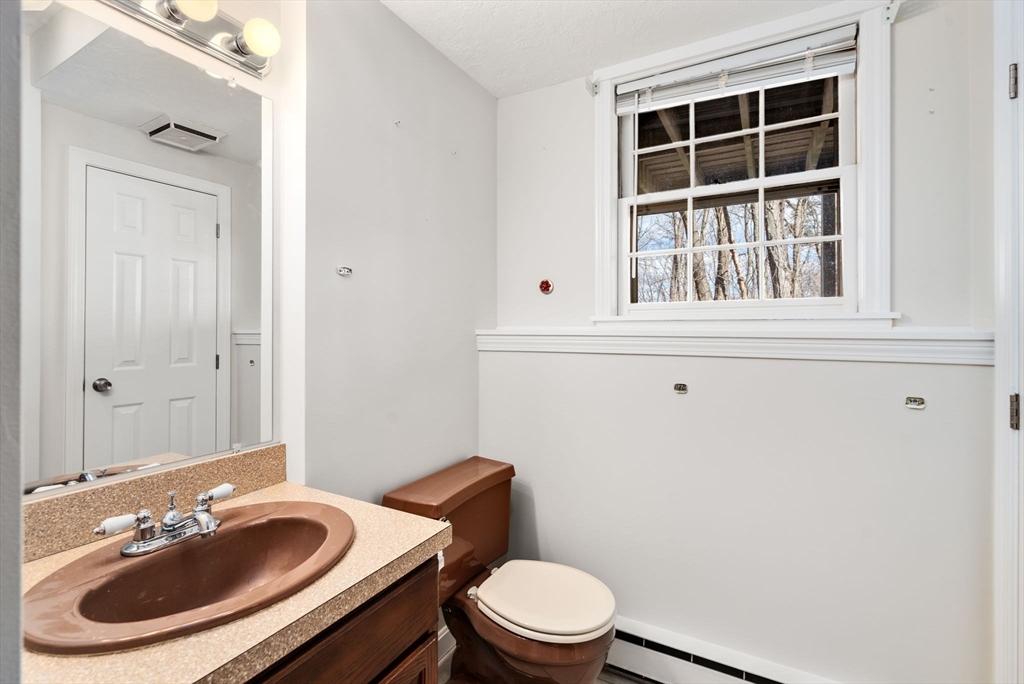 4 Greybirch Road Andover, MA 01810 - Photo 38 of 42 a bathroom with a sink vanity mirror and toilet