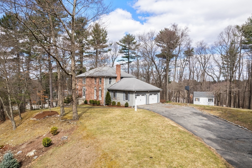 4 Greybirch Road Andover, MA 01810 - Photo 41 of 42 a white house with a large tree in front of it