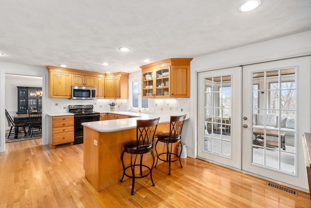 4 Greybirch Road Andover, MA 01810 - Photo 7 of 42 a large kitchen with a table and chairs