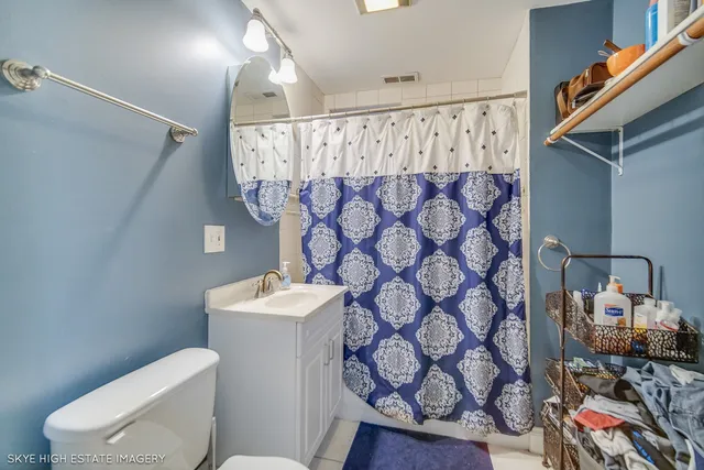 an entryway and livingroom with furniture