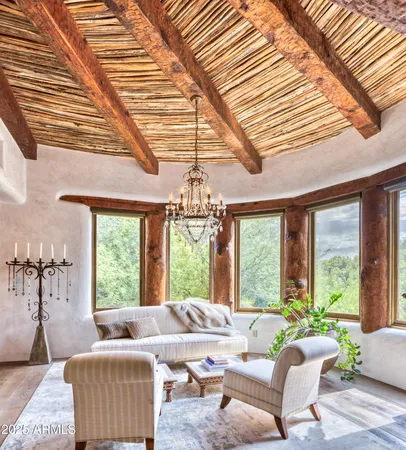 a vase of flowers sitting next to a window