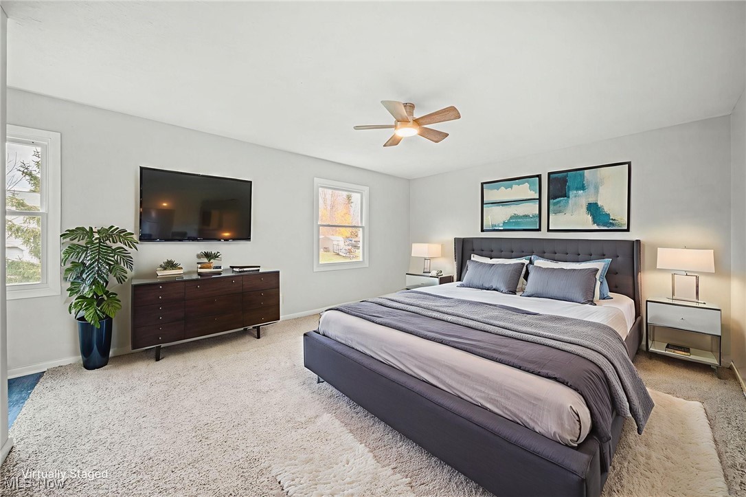 91 Paradise Road Painesville, OH 44077 - Photo 6 of 39 Carpeted bedroom featuring ceiling fan and baseboards