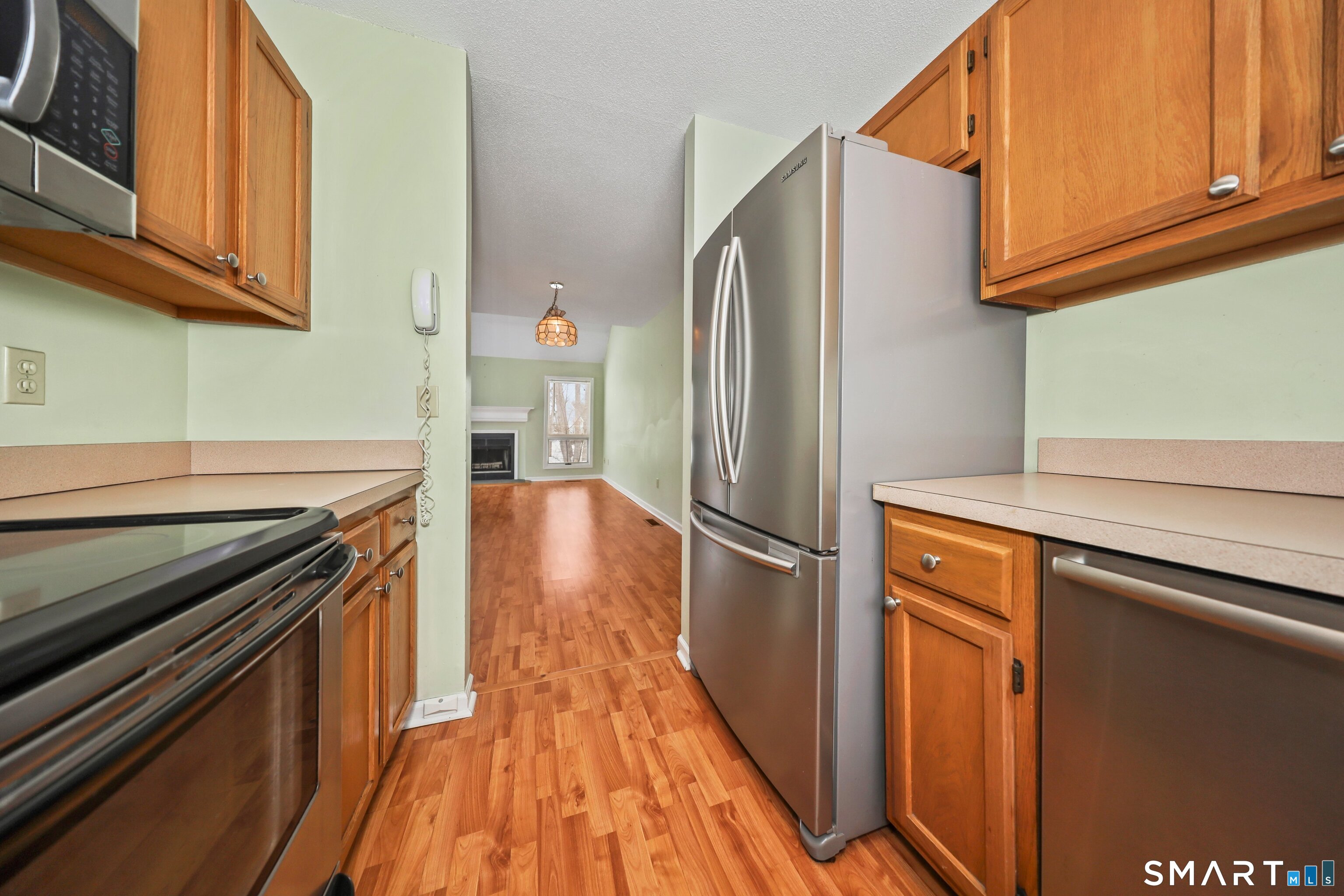 86 Cannon Ridge Drive, Unit 86 Watertown, CT 06795 - Photo 15 of 37 View into the dining area