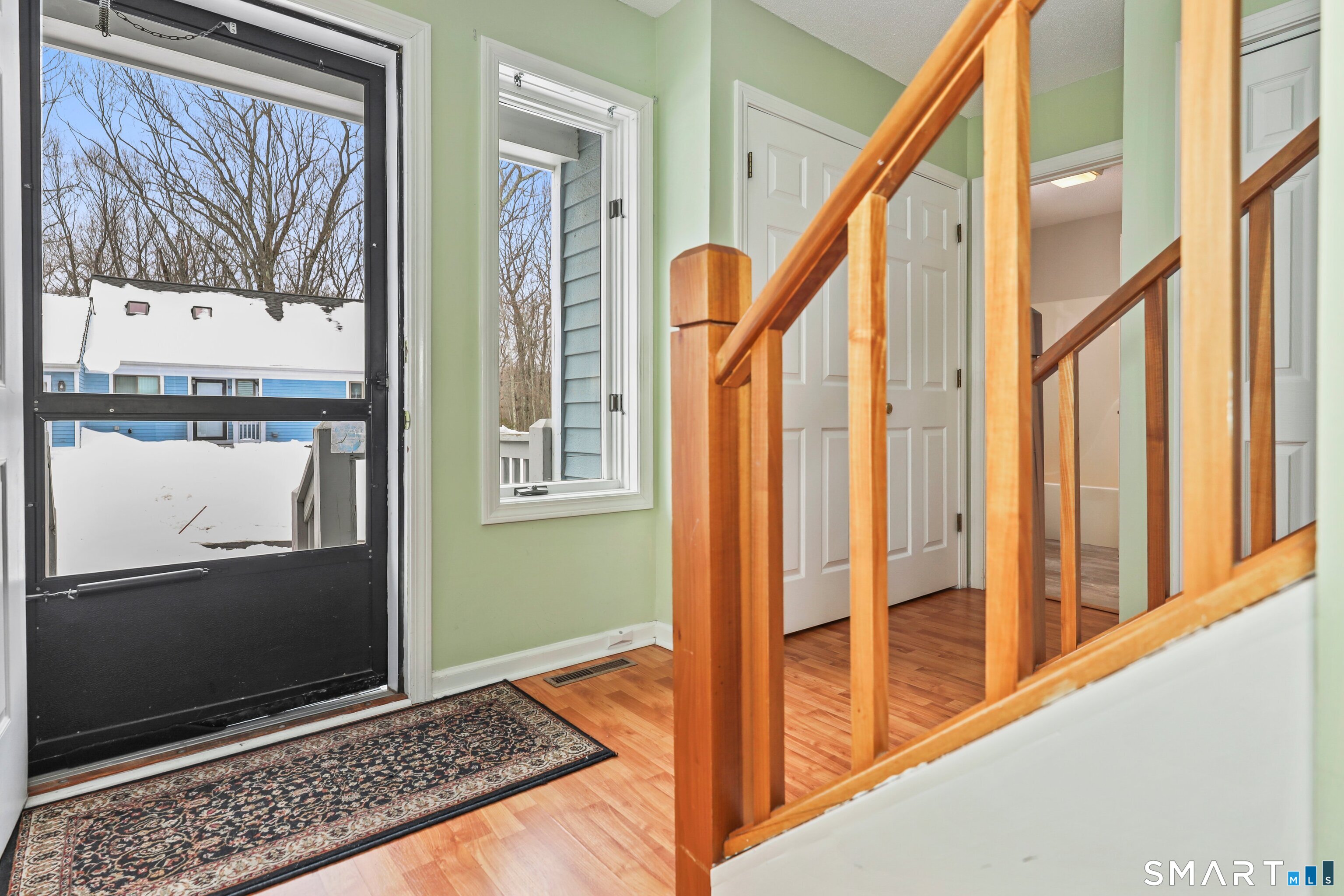 86 Cannon Ridge Drive, Unit 86 Watertown, CT 06795 - Photo 4 of 37 Foyer and view of front porch, laundry closet on the right