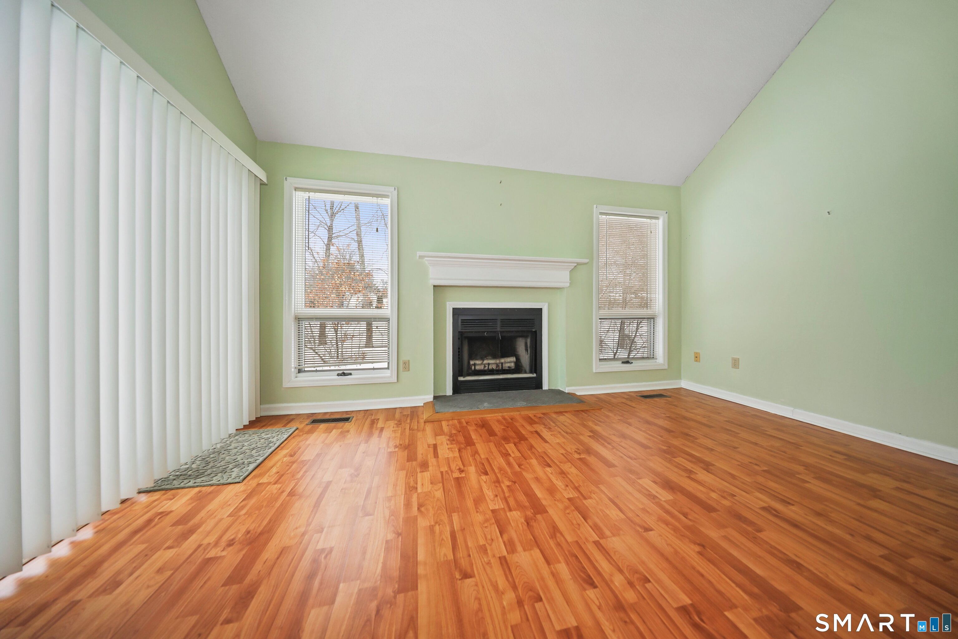 86 Cannon Ridge Drive, Unit 86 Watertown, CT 06795 - Photo 6 of 37 Fireplace and sliders to deck