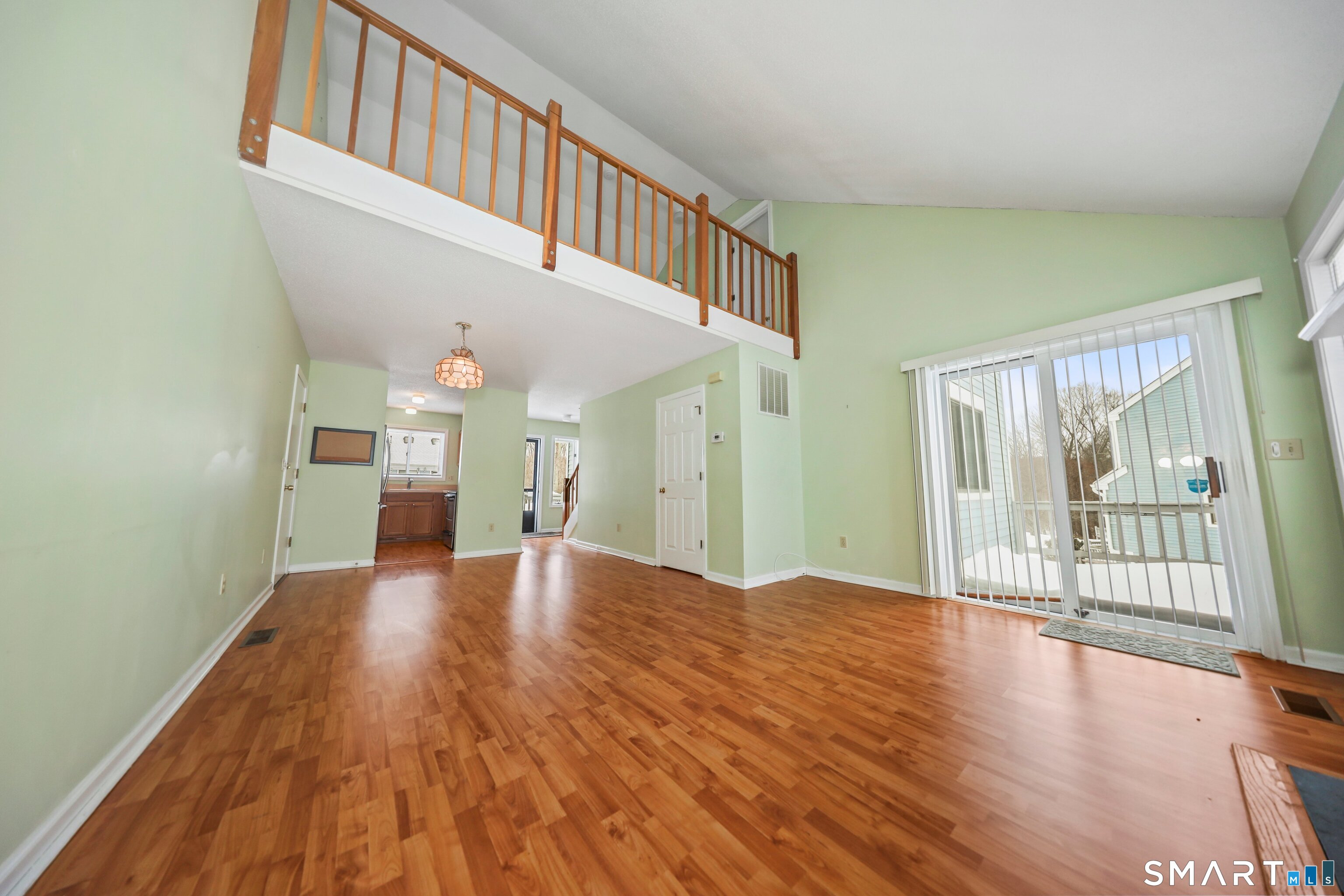 86 Cannon Ridge Drive, Unit 86 Watertown, CT 06795 - Photo 8 of 37 Vaulted ceiling, view of dining area and kitchen in the background