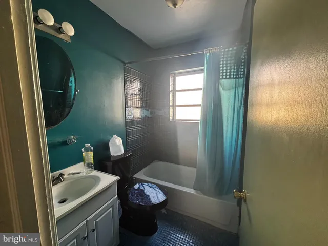 a bathroom with a toilet and a sink