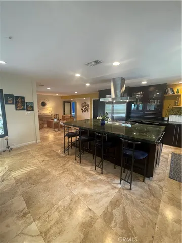 a living room with furniture a table and chairs in it