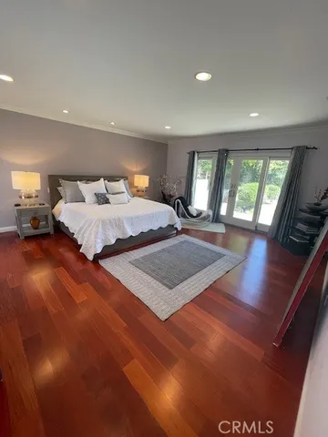 a bedroom with a bed and a night stand