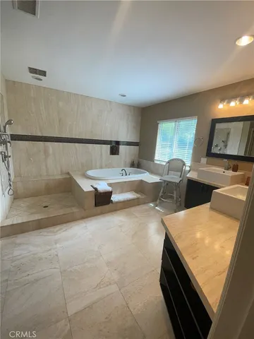 a kitchen with a sink and a stove top oven
