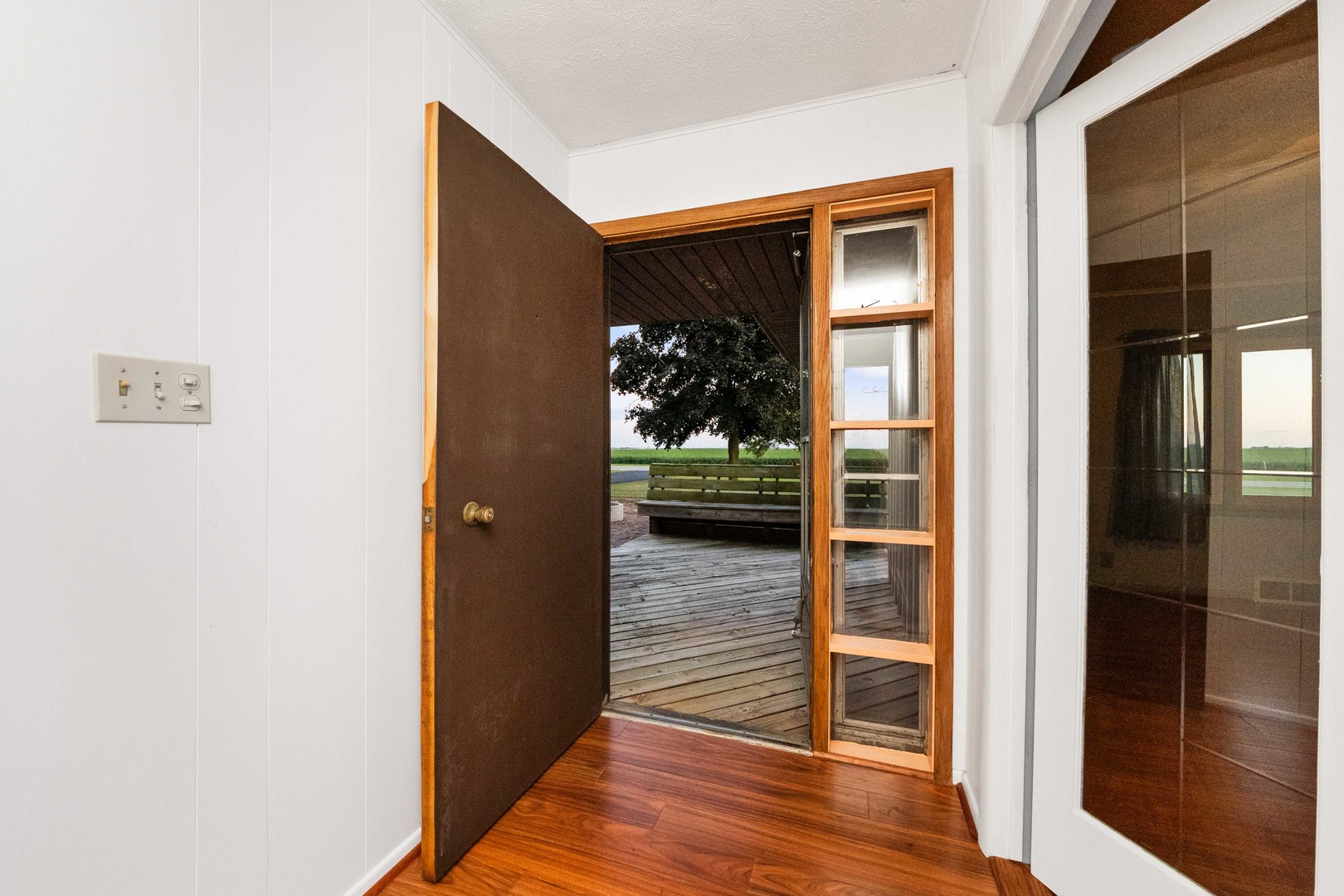 947 North 2nd Road Dana, IL 61321 - Photo 14 of 35 a view of a hallway with wooden floor and a dining room