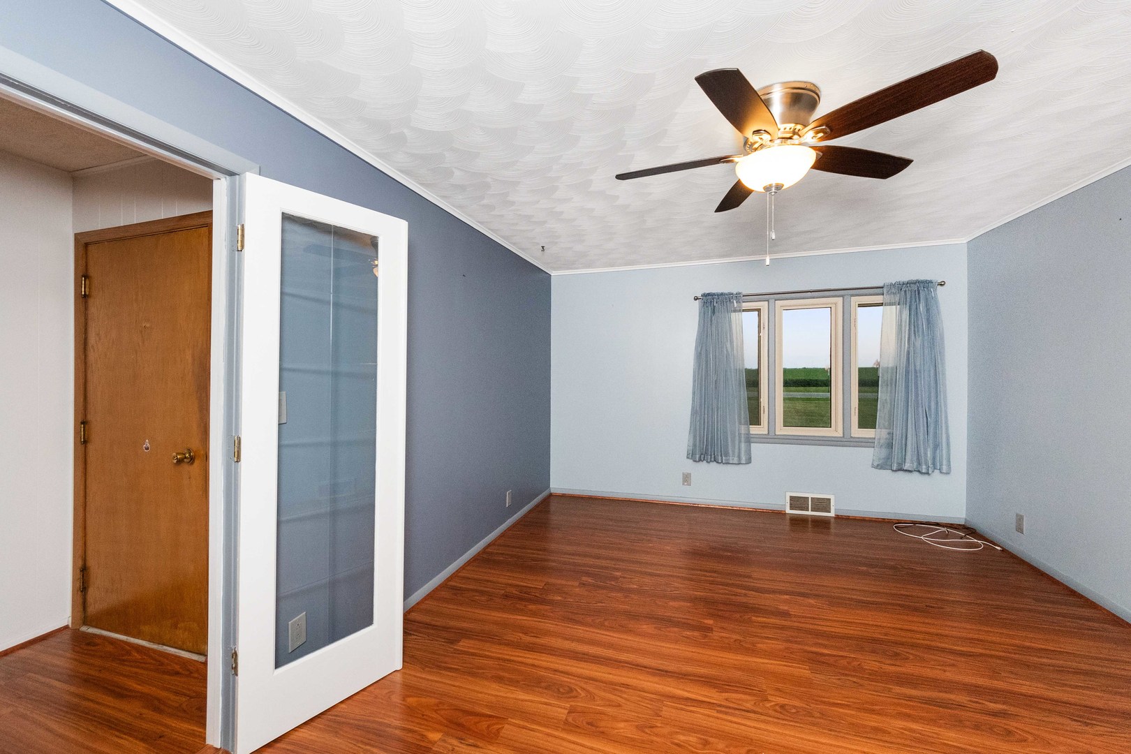 947 North 2nd Road Dana, IL 61321 - Photo 15 of 35 a view of an empty room with wooden floor and a window