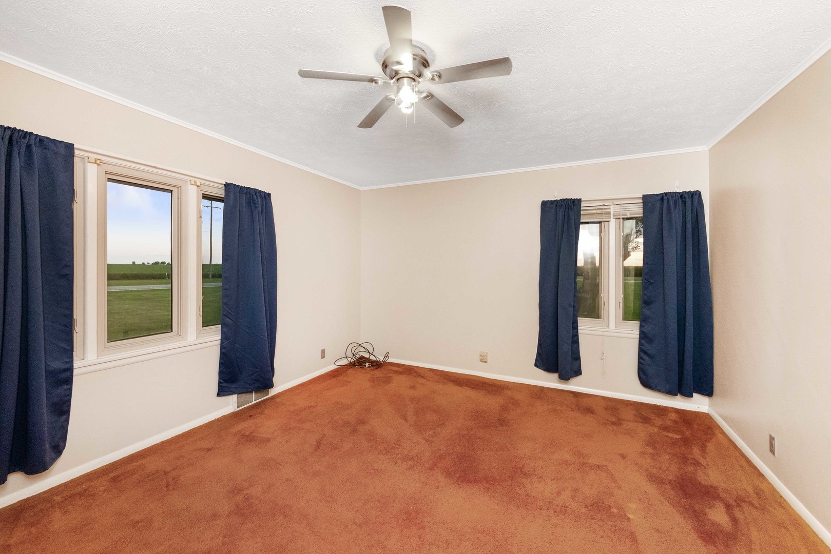947 North 2nd Road Dana, IL 61321 - Photo 18 of 35 a view of an empty room with chandelier fan and a window