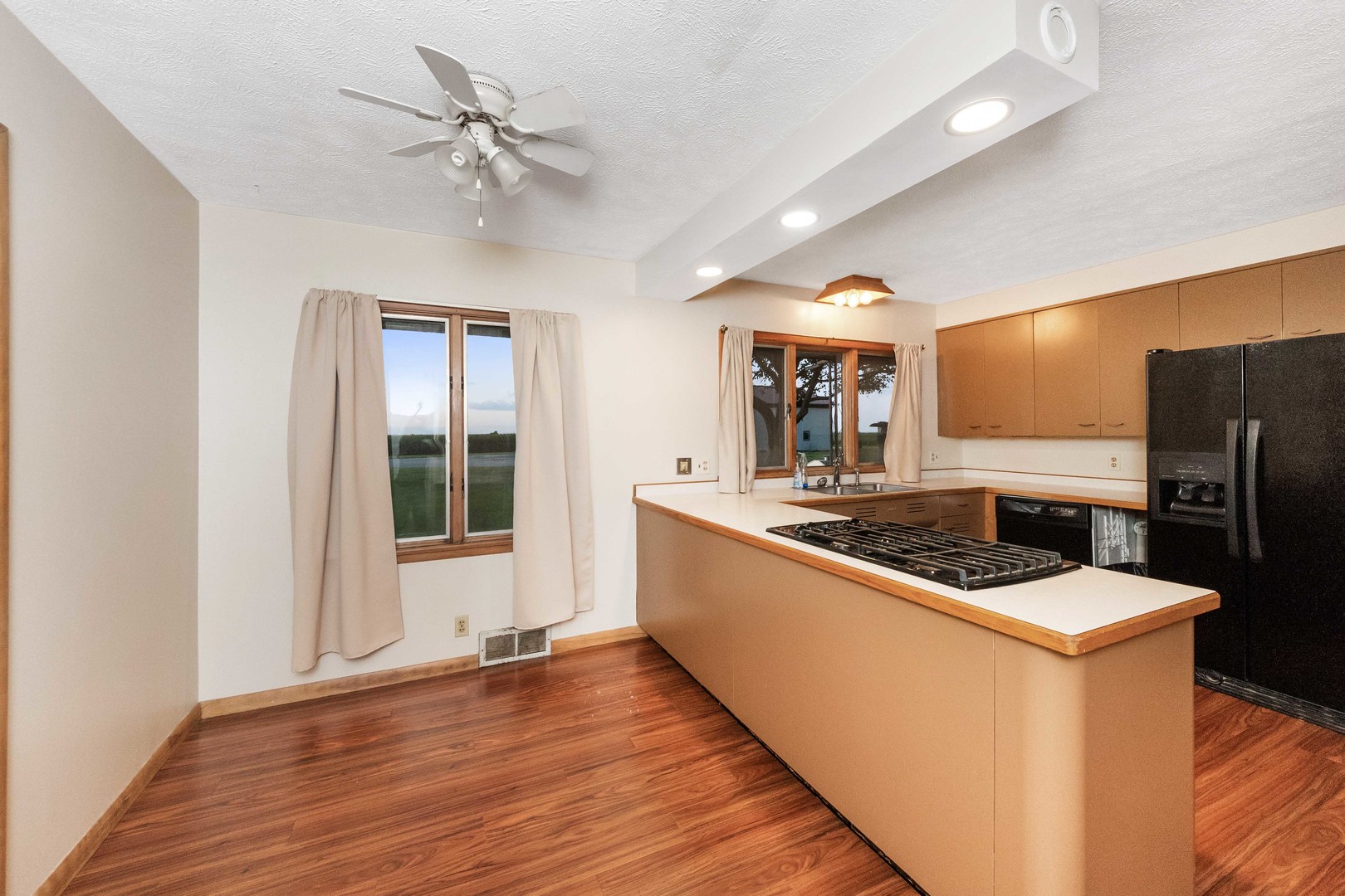 947 North 2nd Road Dana, IL 61321 - Photo 5 of 35 a kitchen with stainless steel appliances granite countertop a sink and a refrigerator