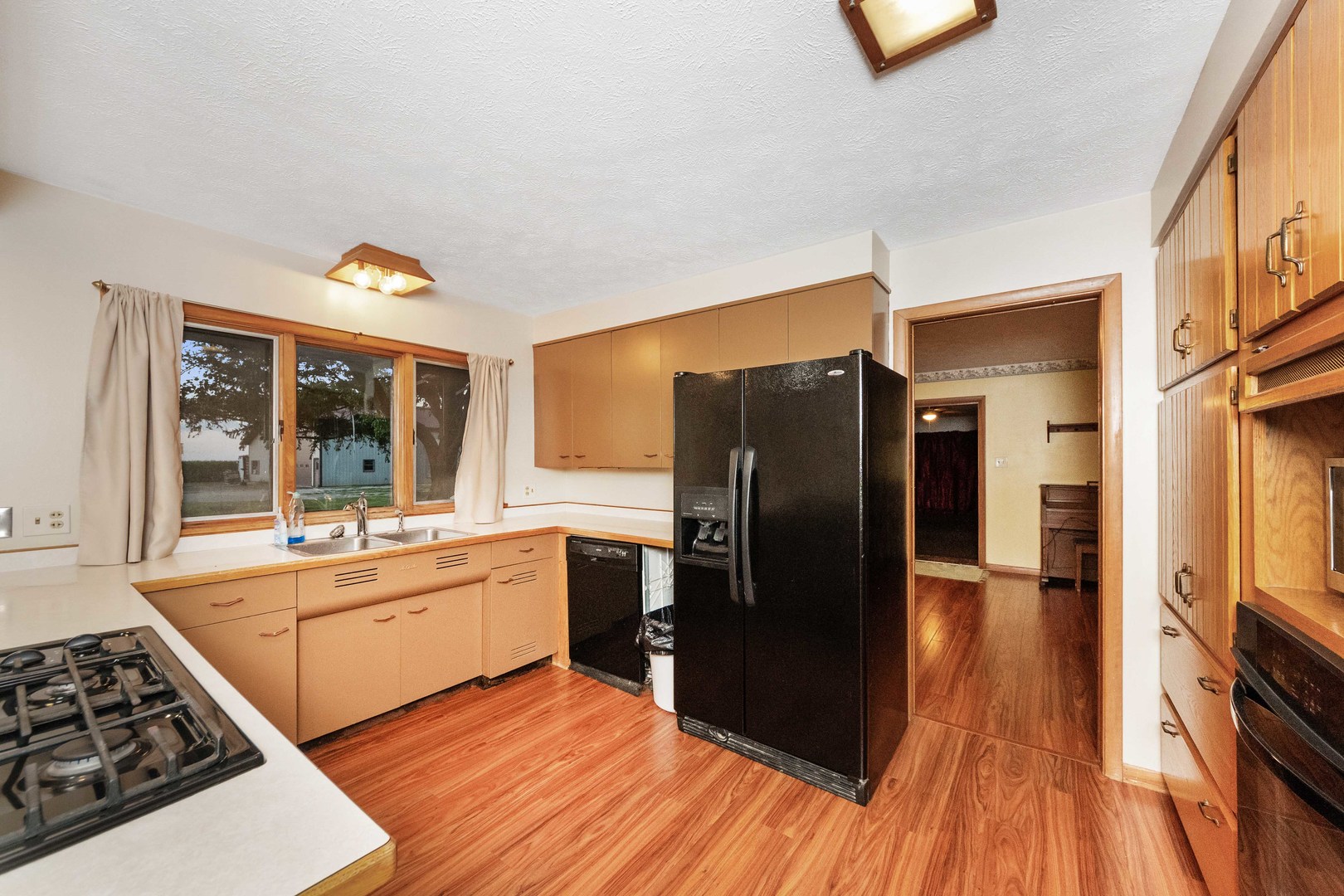 947 North 2nd Road Dana, IL 61321 - Photo 6 of 35 a kitchen with stainless steel appliances granite countertop a refrigerator a stove and a wooden floors