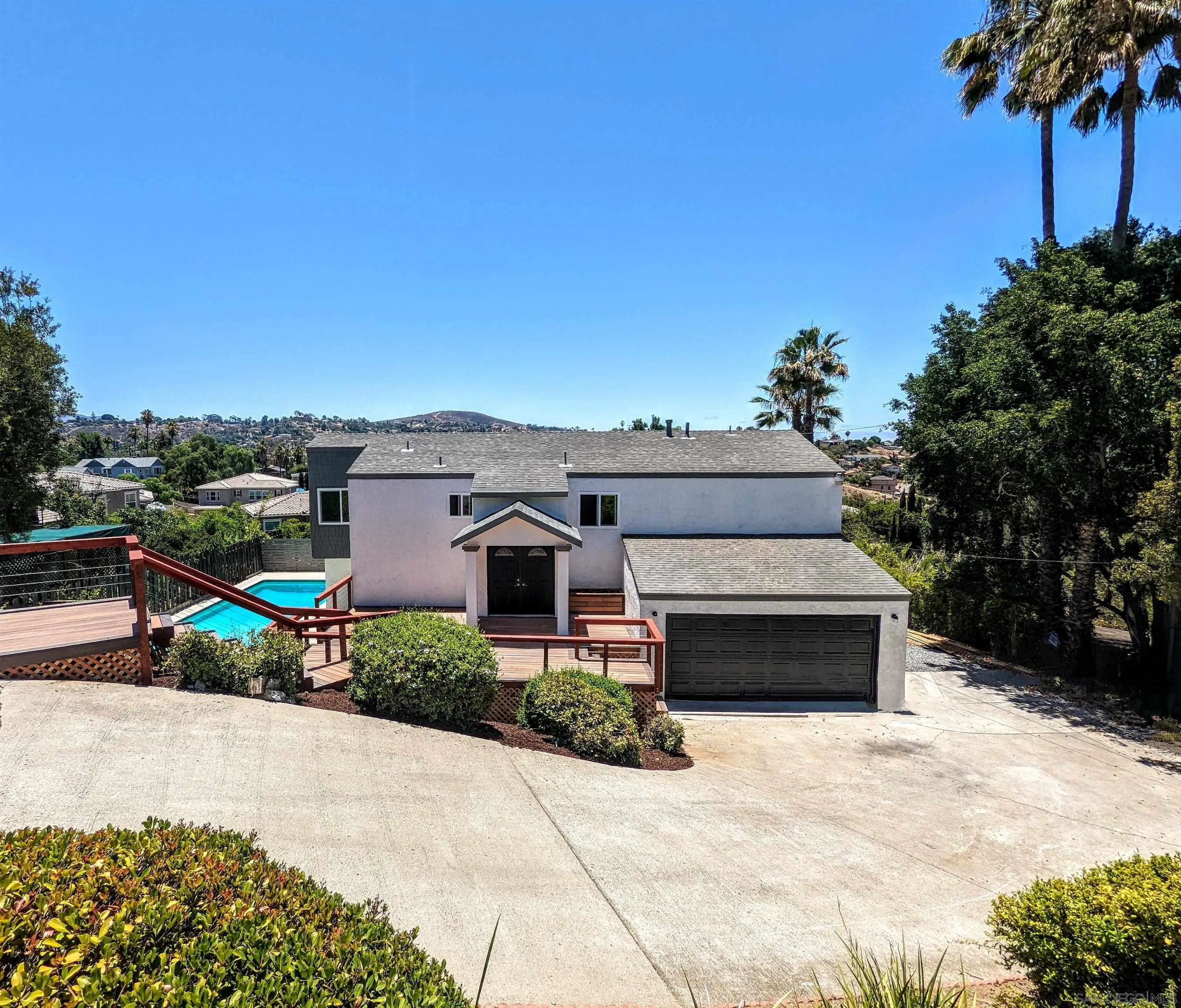 9347 Kahlua Way Spring Valley, CA 91977 - Photo 1 of 67 a front view of a house with a yard