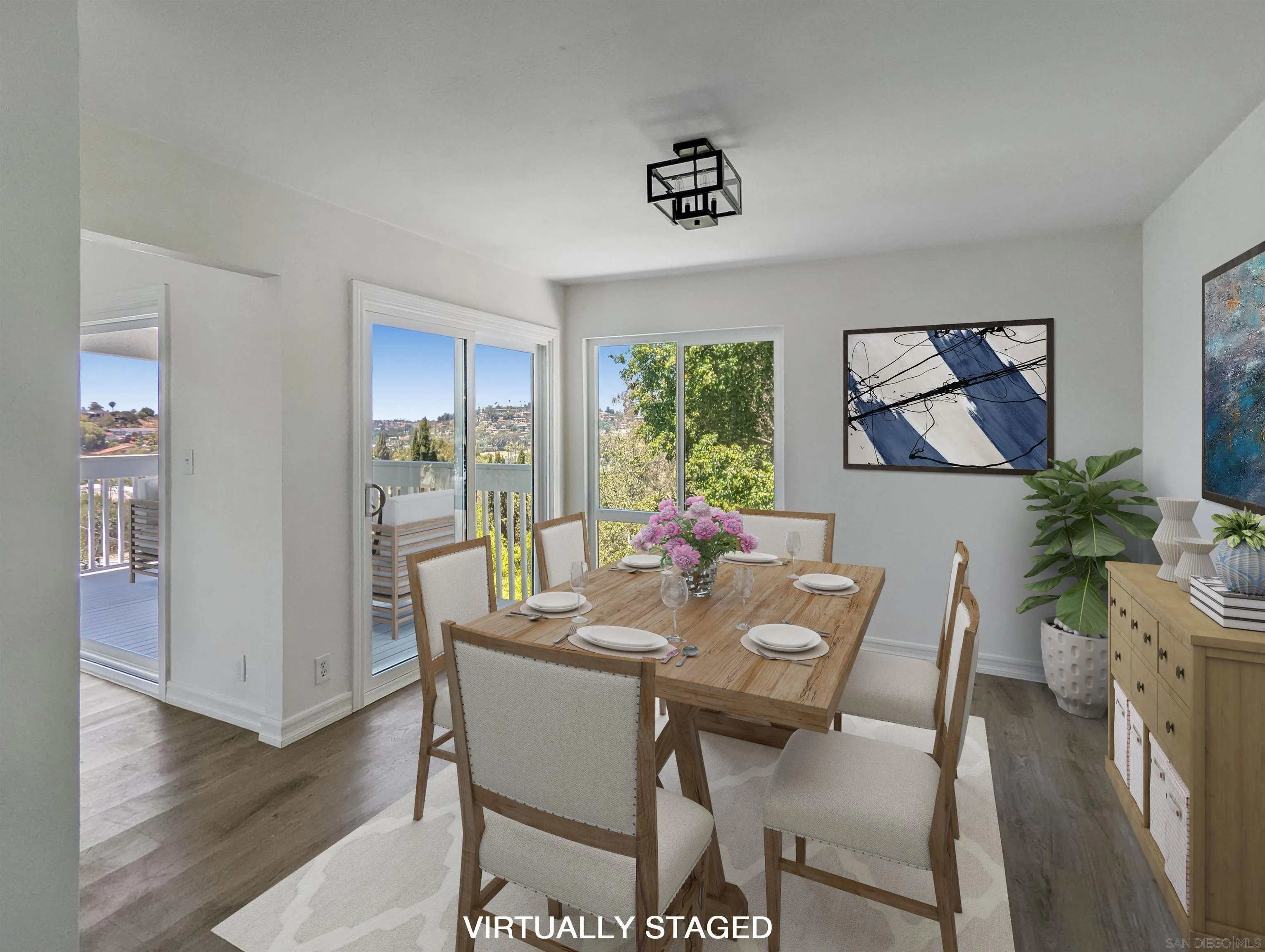 9347 Kahlua Way Spring Valley, CA 91977 - Photo 14 of 67 a view of a dining room with furniture window and wooden floor
