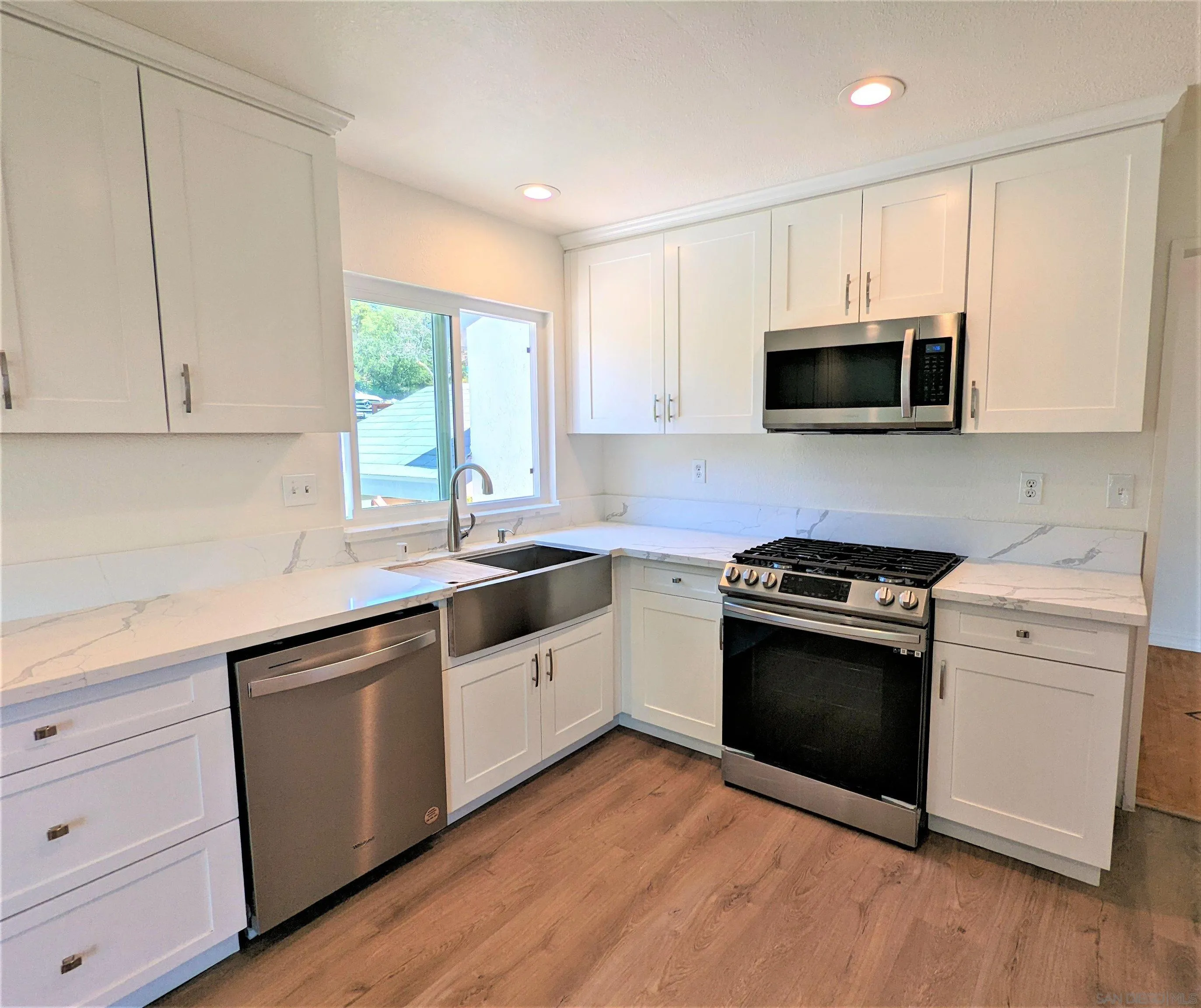 9347 Kahlua Way Spring Valley, CA 91977 - Photo 3 of 67 a kitchen with granite countertop a sink and steel appliances