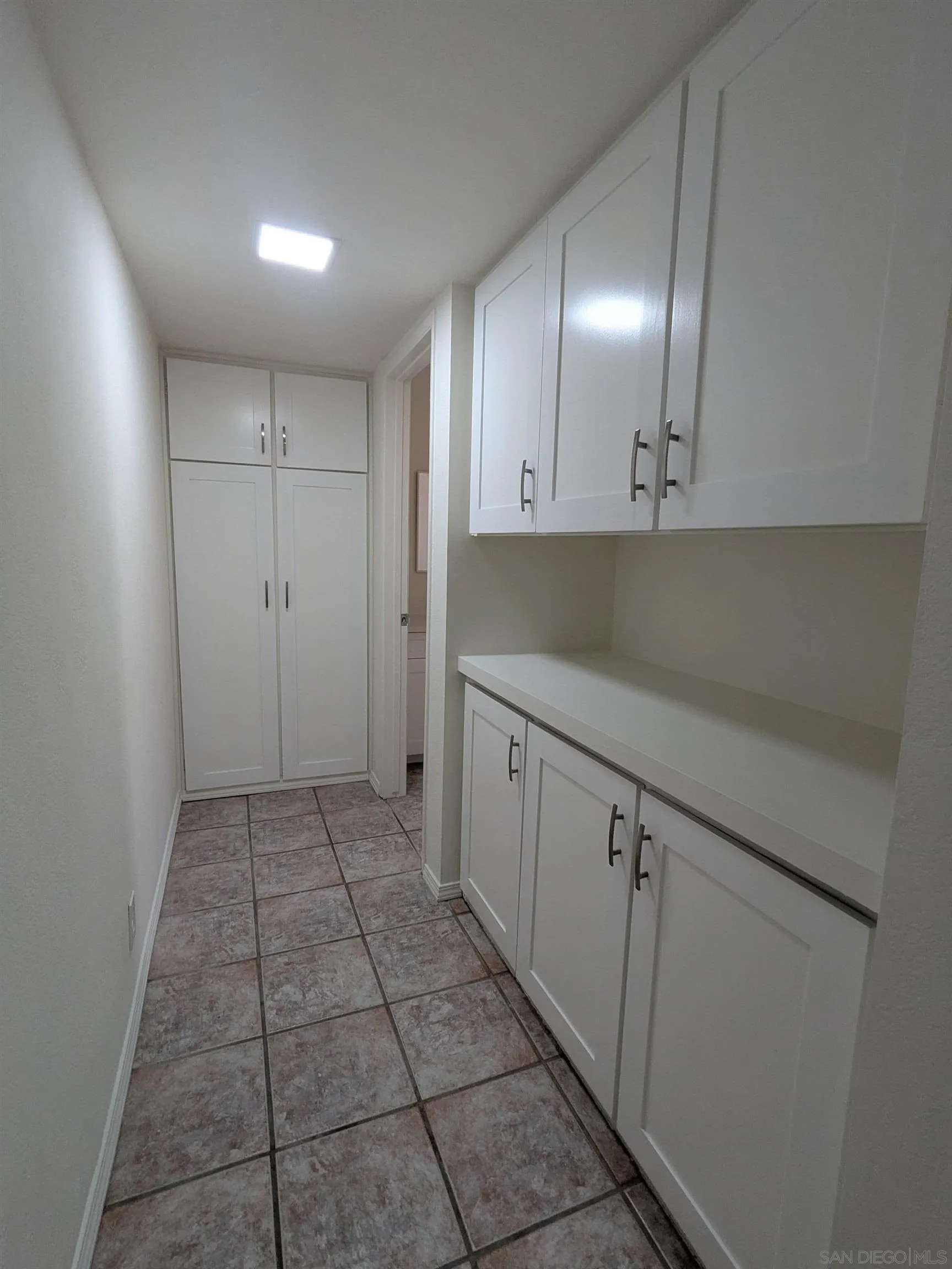9347 Kahlua Way Spring Valley, CA 91977 - Photo 36 of 67 a view of a kitchen with white cabinets