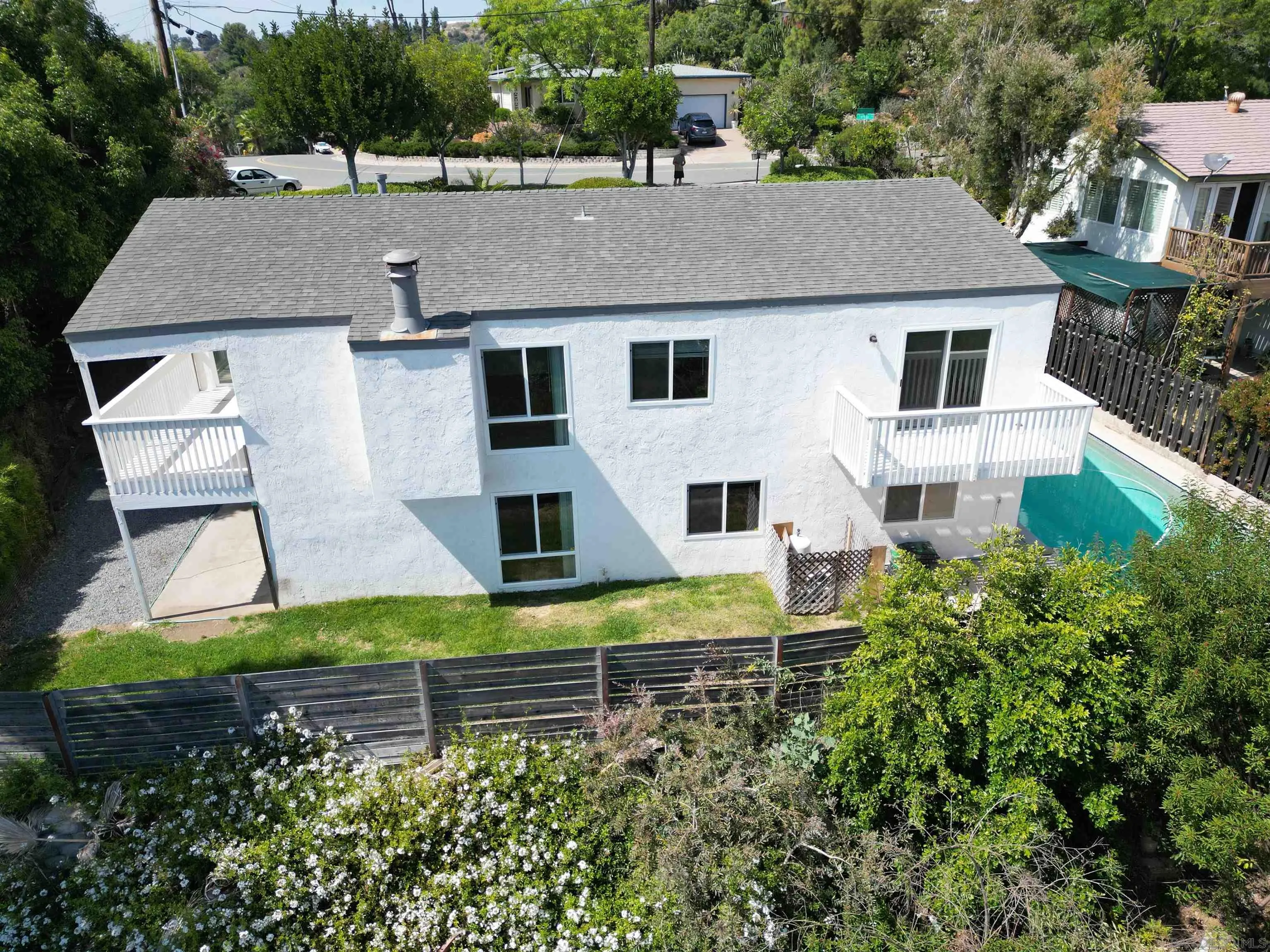 9347 Kahlua Way Spring Valley, CA 91977 - Photo 45 of 67 a aerial view of a house with a yard and potted plants
