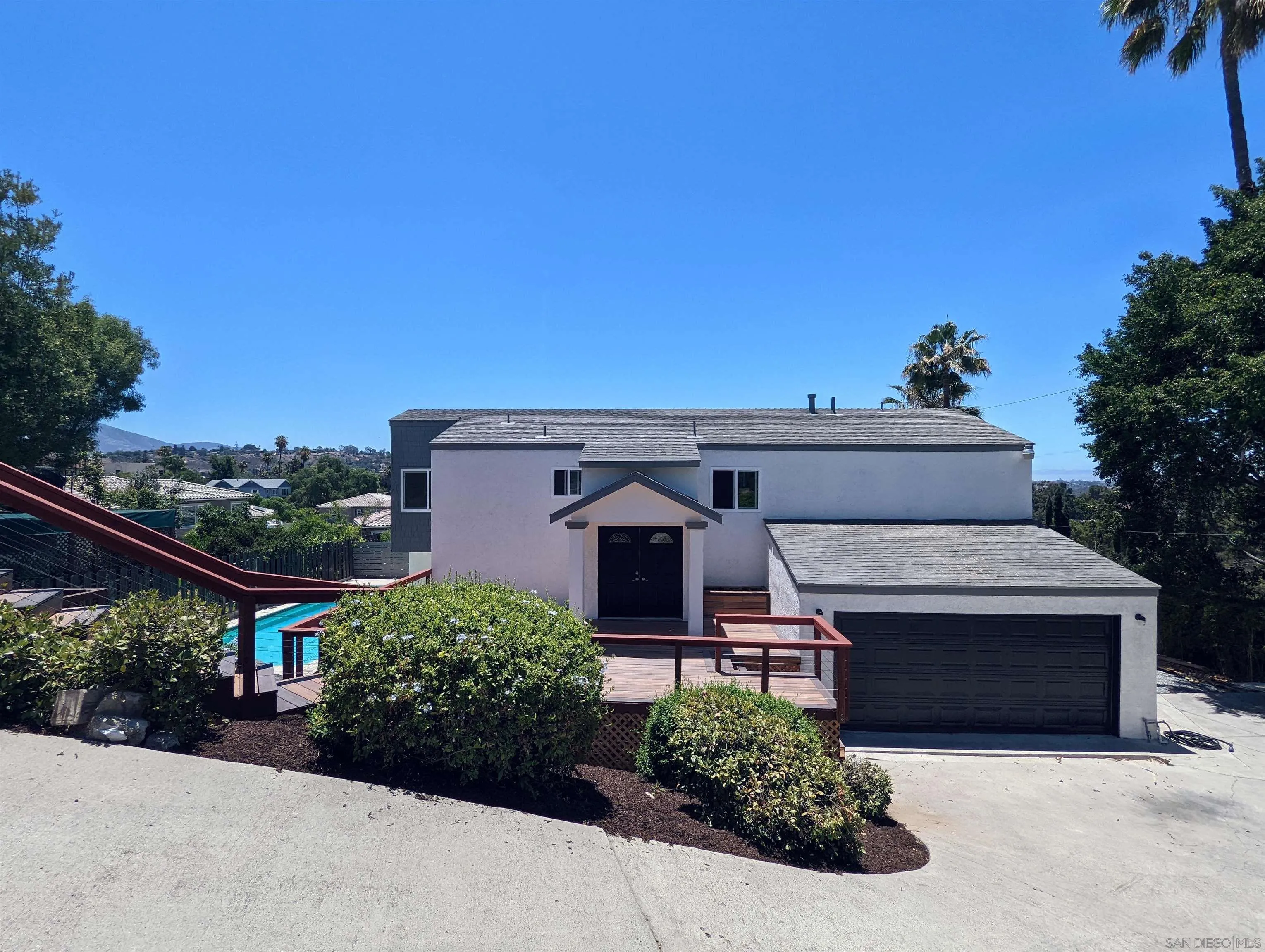 9347 Kahlua Way Spring Valley, CA 91977 - Photo 47 of 67 a front view of a house with a garden