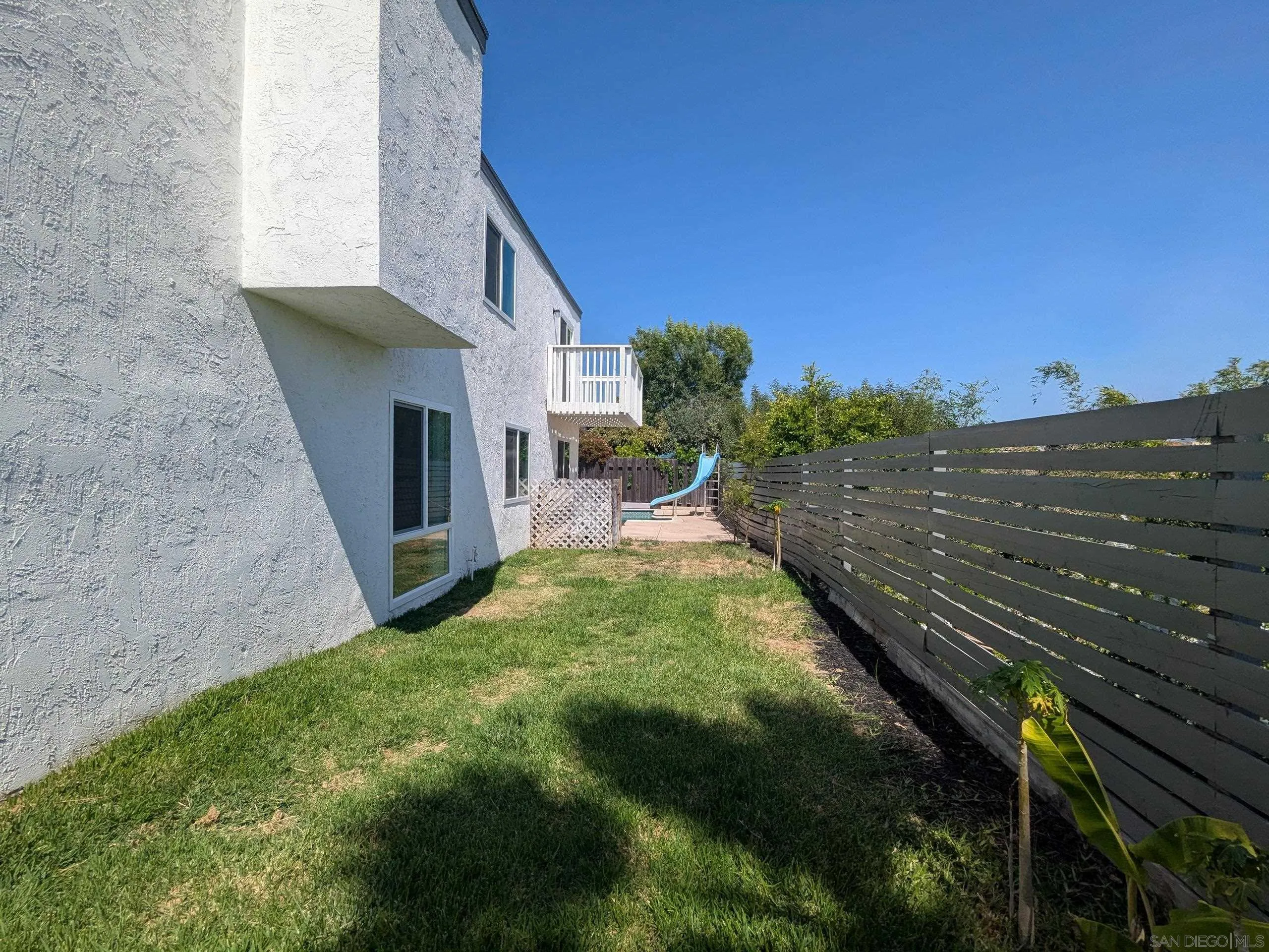 9347 Kahlua Way Spring Valley, CA 91977 - Photo 60 of 67 a view of a backyard with plants