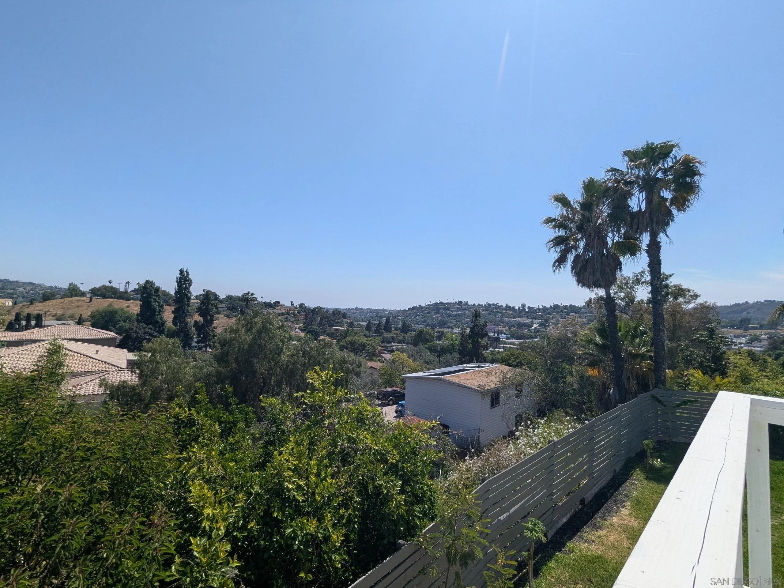 9347 Kahlua Way Spring Valley, CA 91977 - Photo 62 of 67 a view of a terrace with a garden and wooden fence