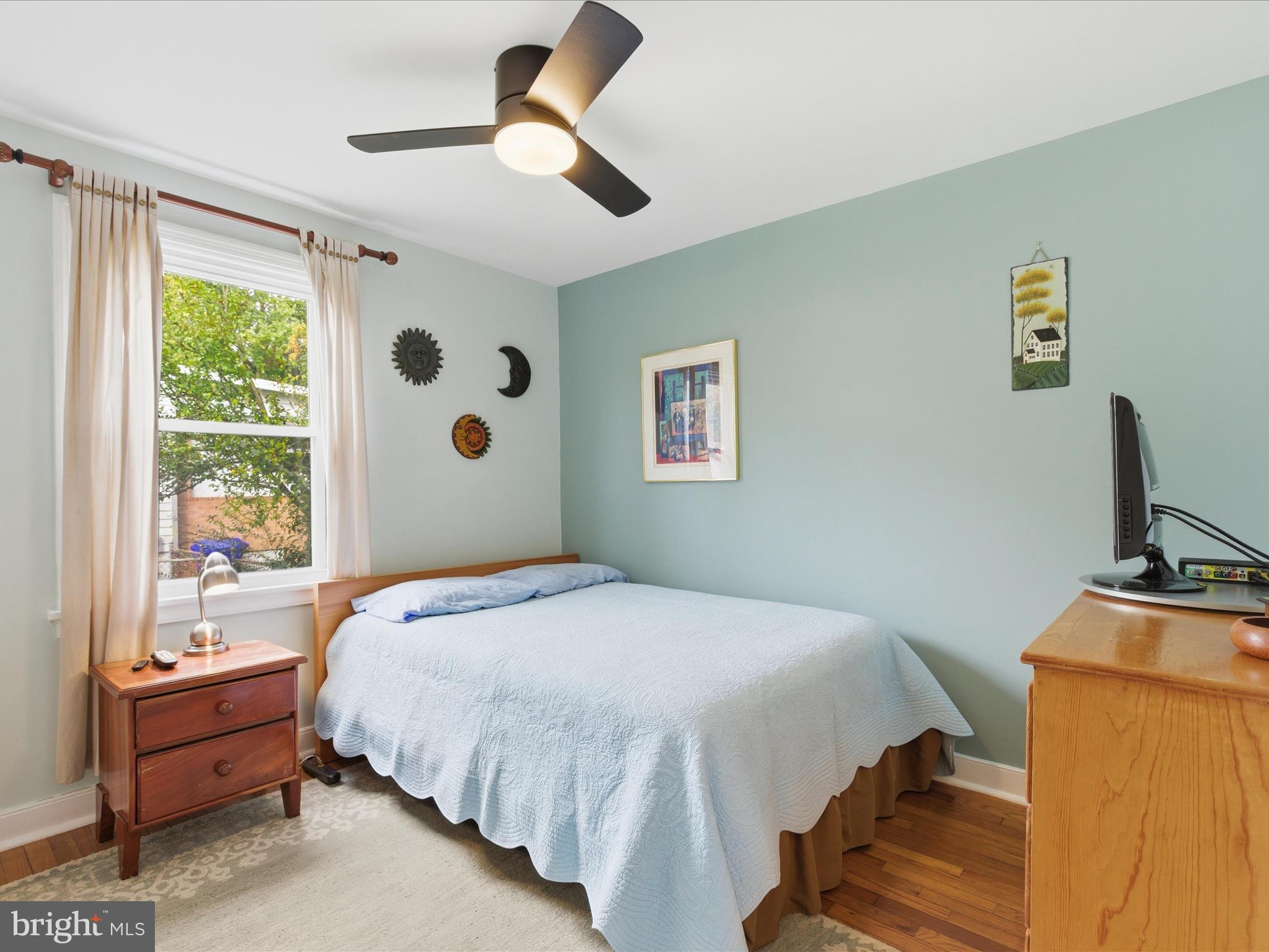 2707 Lindell Street Silver Spring, MD 20902 - Photo 21 of 52 a bedroom with a bed dresser and a window