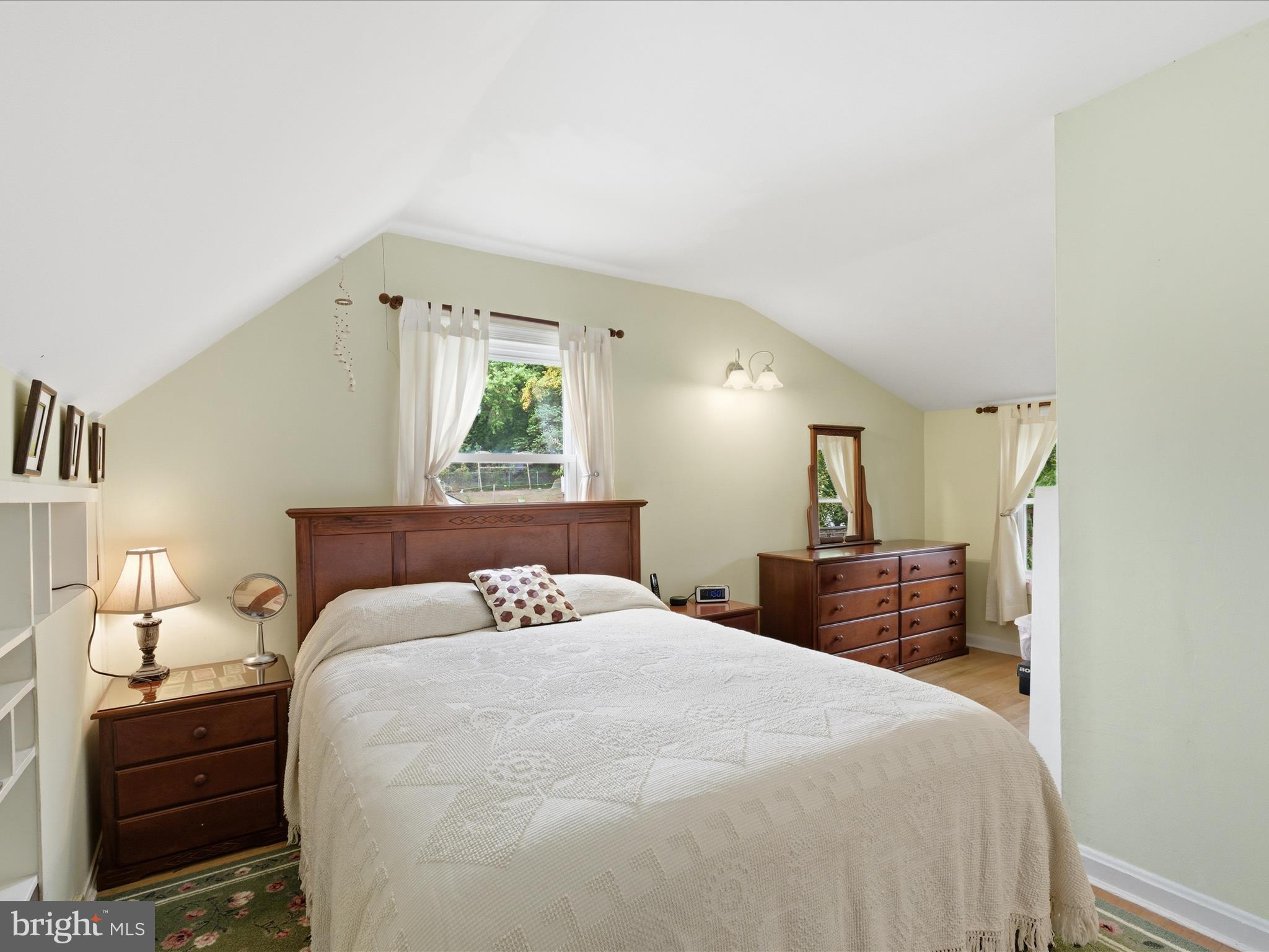 2707 Lindell Street Silver Spring, MD 20902 - Photo 28 of 52 a bedroom with a bed and a lamp