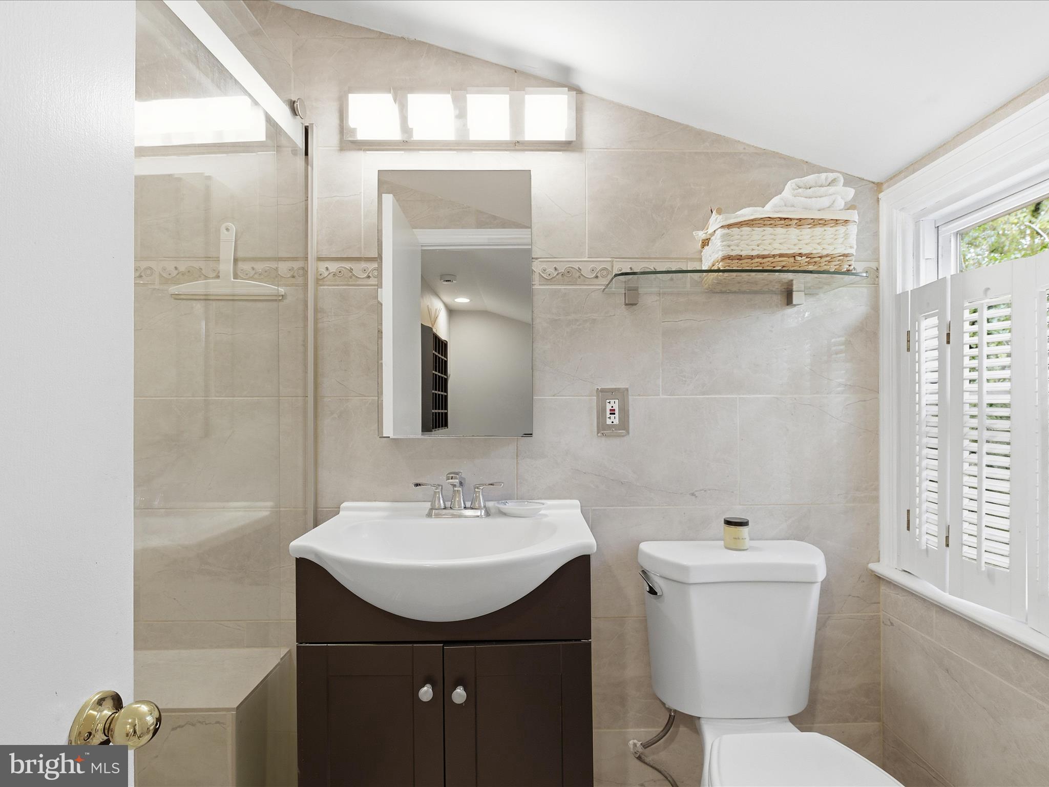 2707 Lindell Street Silver Spring, MD 20902 - Photo 31 of 52 a bathroom with a sink toilet and shower