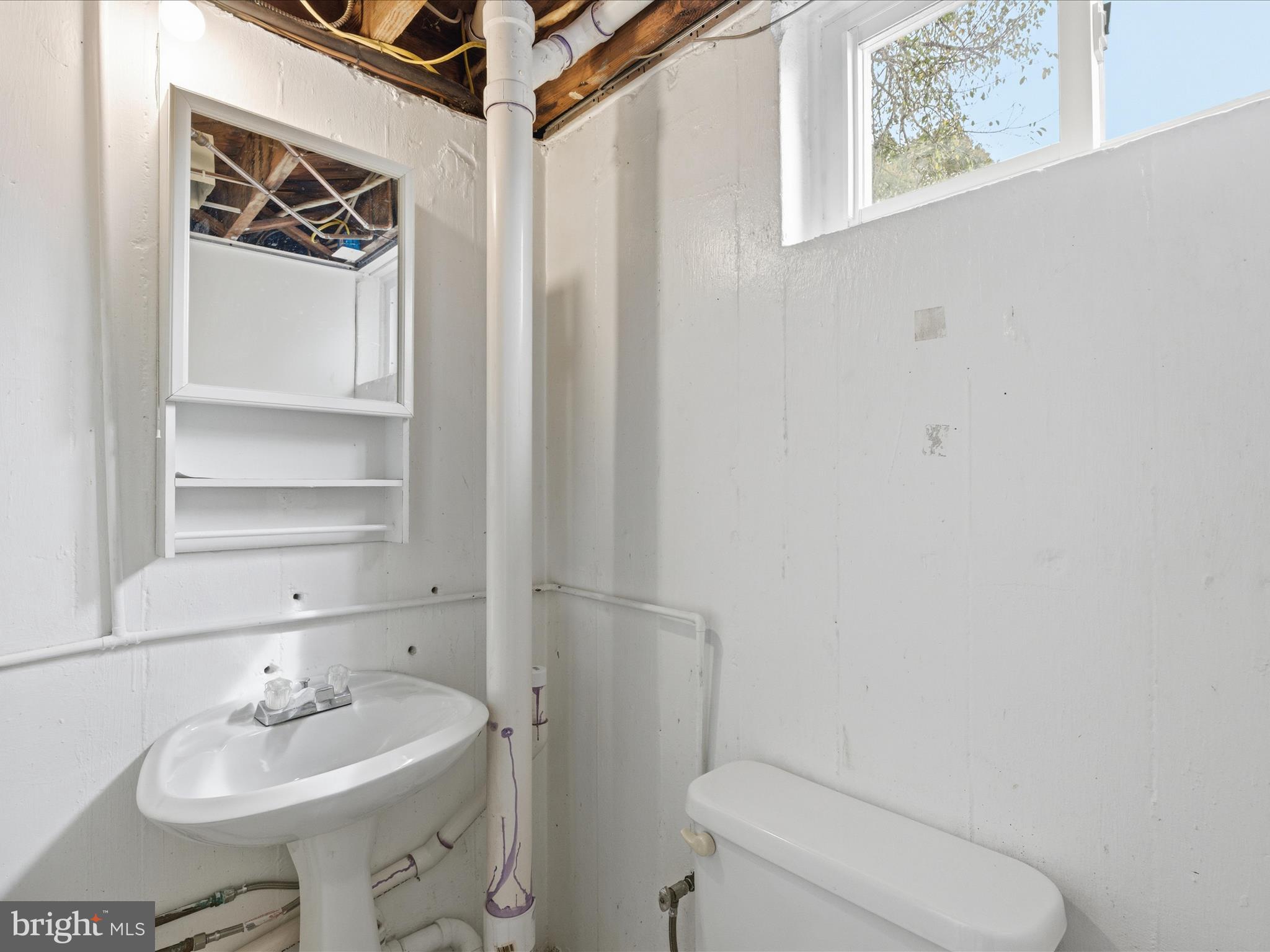 2707 Lindell Street Silver Spring, MD 20902 - Photo 40 of 52 a bathroom with a sink toilet and shower