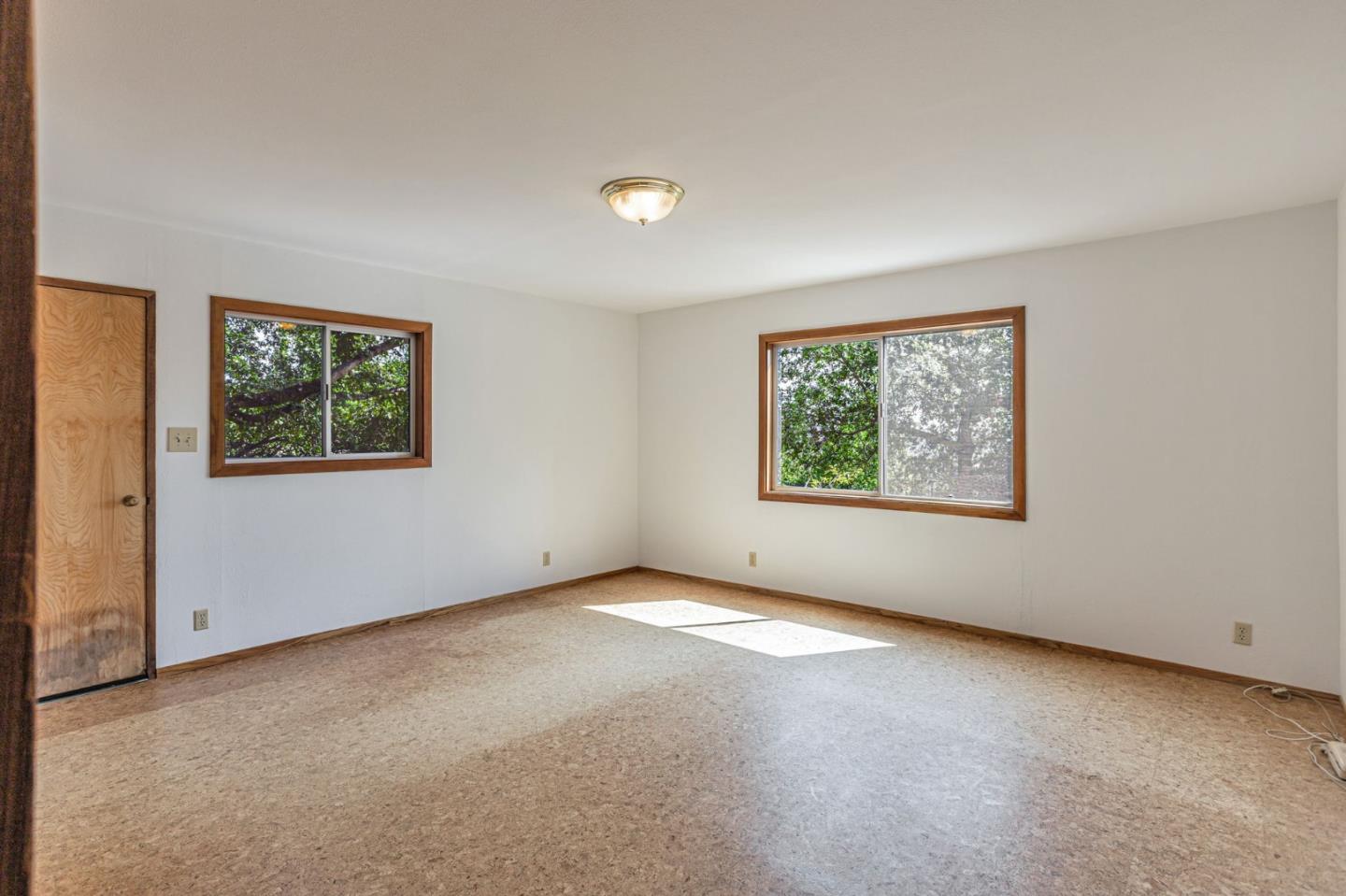 22178 Miller Ridge Road Los Gatos, CA 95033 - Photo 12 of 33 an empty room with windows