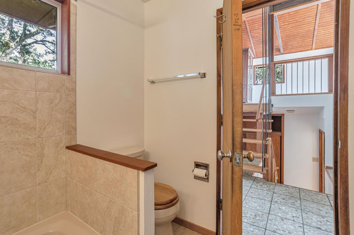 22178 Miller Ridge Road Los Gatos, CA 95033 - Photo 19 of 33 a bathroom with a toilet and a shower