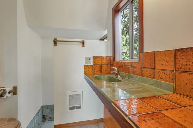 a view of backyard with large trees