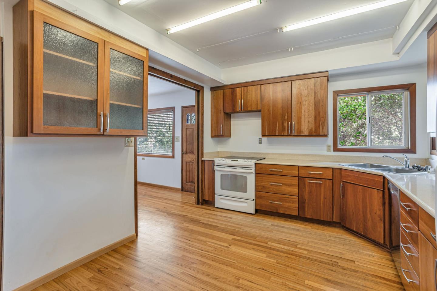 22178 Miller Ridge Road Los Gatos, CA 95033 - Photo 8 of 33 a kitchen with stainless steel appliances granite countertop a stove a sink and a refrigerator