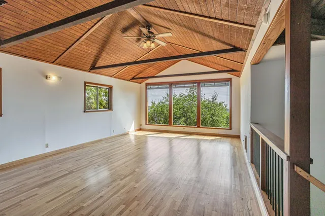 a view of a room that has a large window