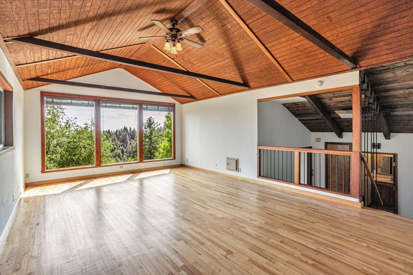 22178 Miller Ridge Road Los Gatos, CA 95033 - Photo 10 of 33 a view of a deck with wooden floor and roof with a yard