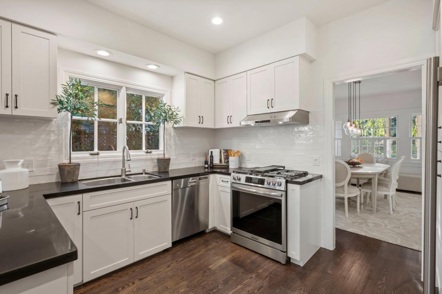 445 Arlington Road Redwood City, CA 94062 - Photo 12 of 50 a kitchen with a stove sink and cabinets