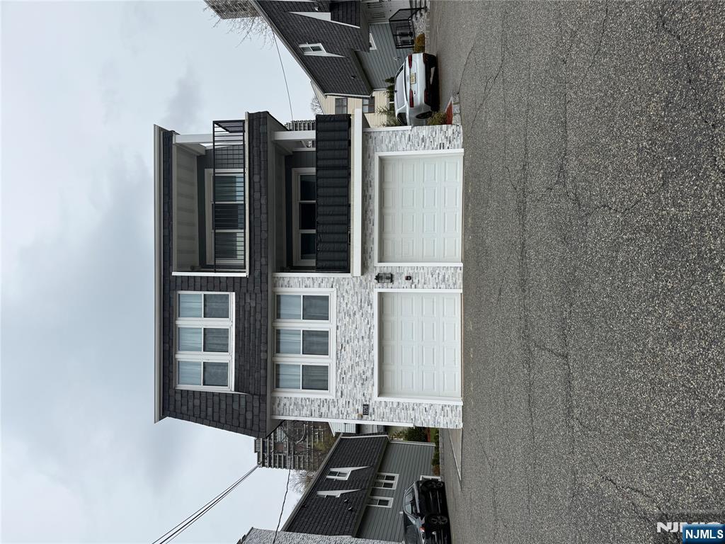 a view of building with car parked
