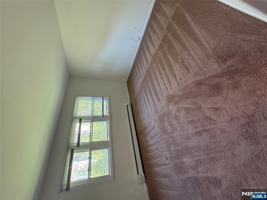1276 River Road, Unit 2 Edgewater, NJ 07020 - Photo 11 of 16 a view of an empty room with a window