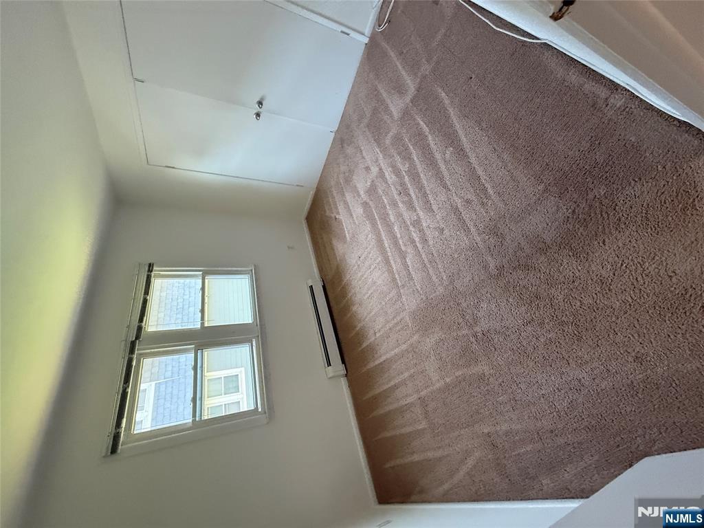 1276 River Road, Unit 2 Edgewater, NJ 07020 - Photo 15 of 16 an empty room with windows